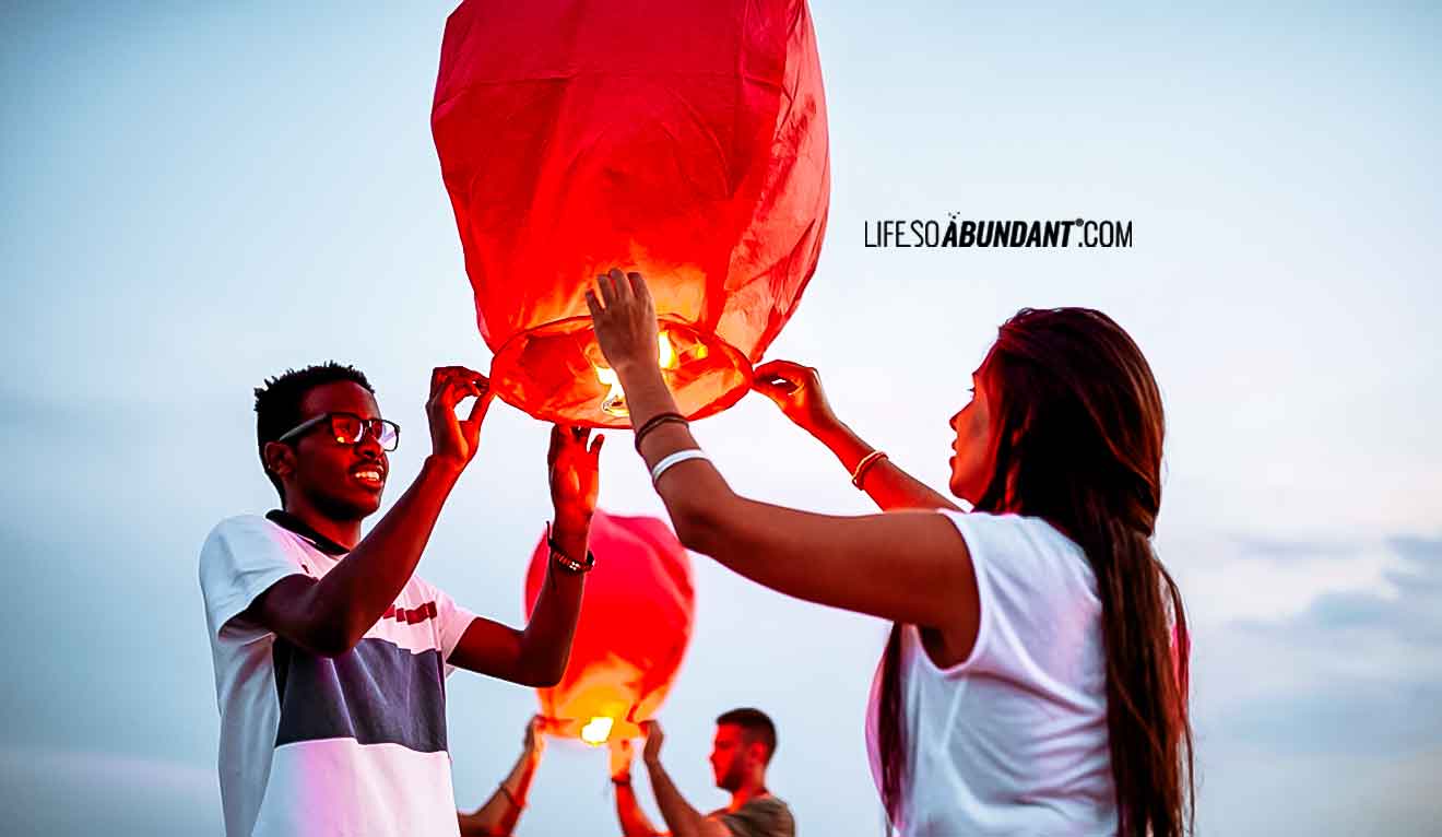 Let Go, Inner Peace, Smiling Couple Launching Chinese Lanterns - Life So Abundant®